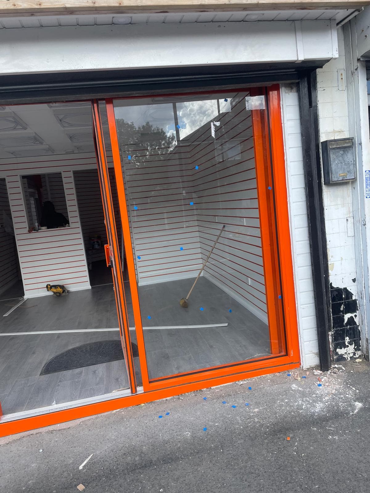 Steel security grille protecting retail shopfront overnight